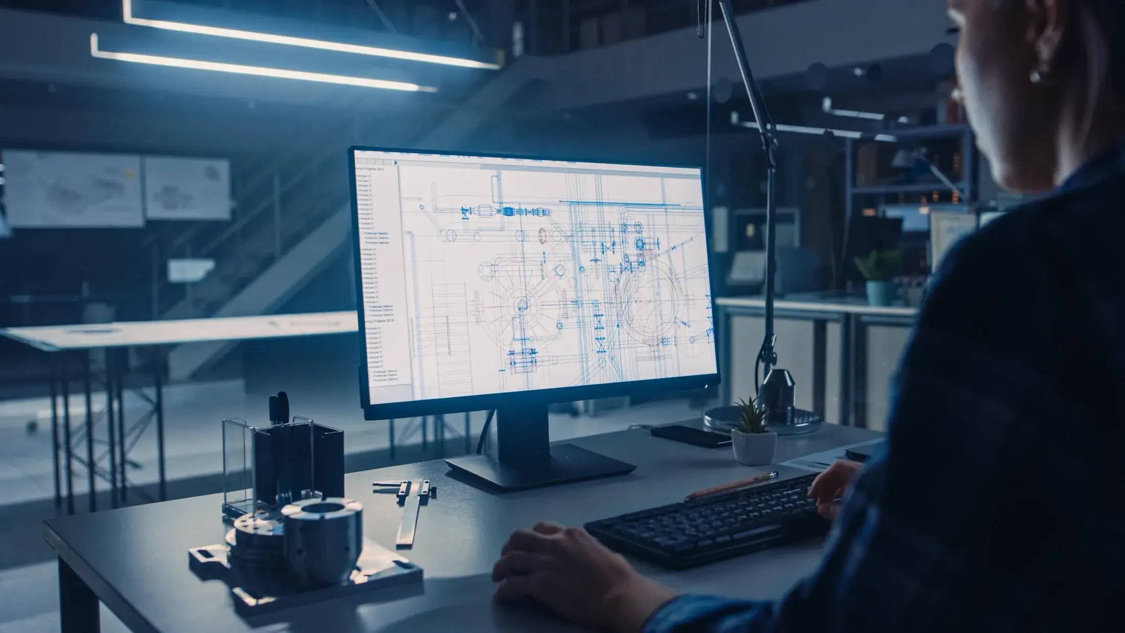 man-sits-desk-front-computer-screen-that-says-data