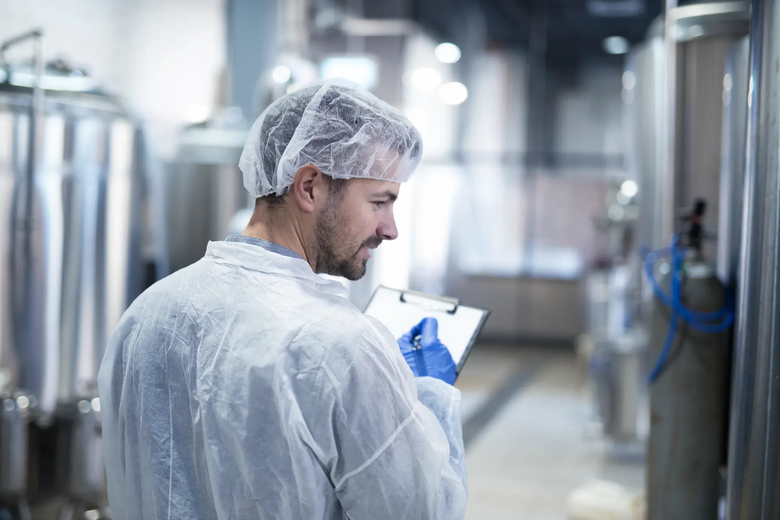 technologist-controlling-production-factory